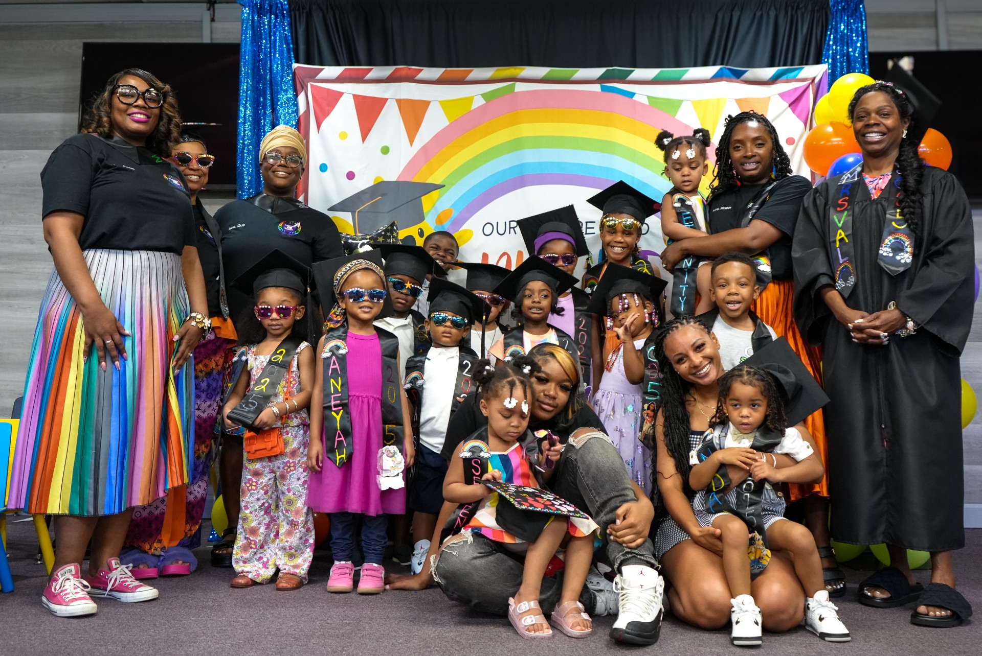 The full Academy graduation class with teachers and families